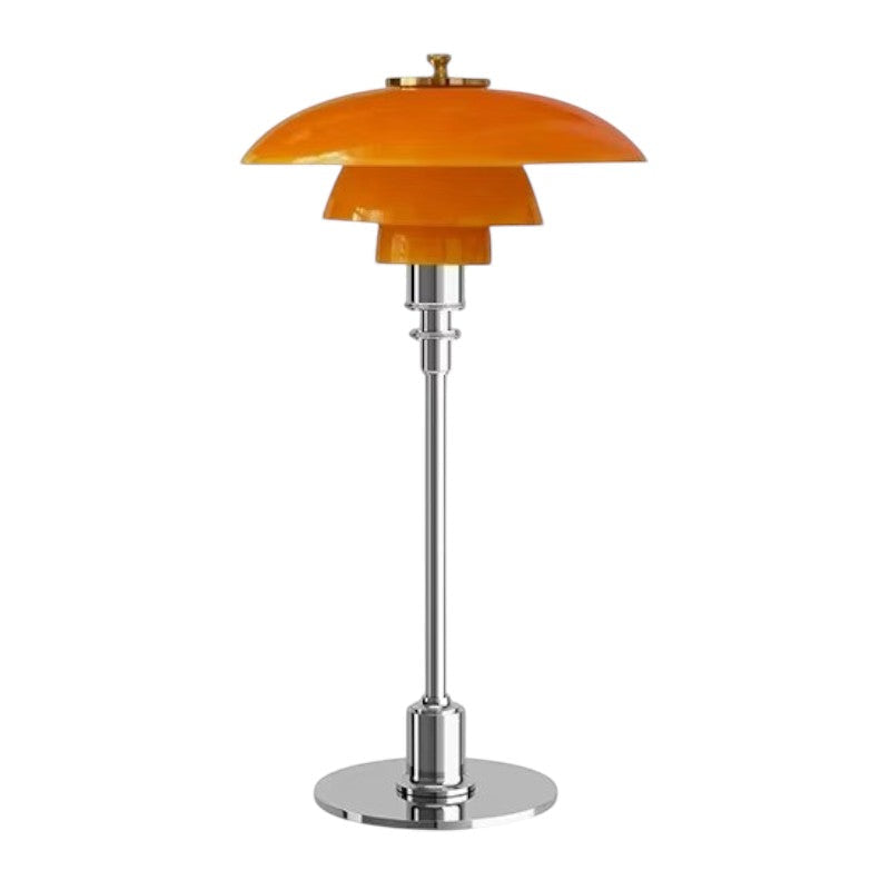 Table lamp with orange glass shade and chrome base on a white background
